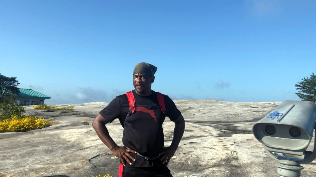 Man standing on top of Stone Mountain